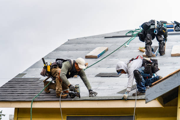 Professional Storm Damage Roof Repair technician working in Glen, NH
